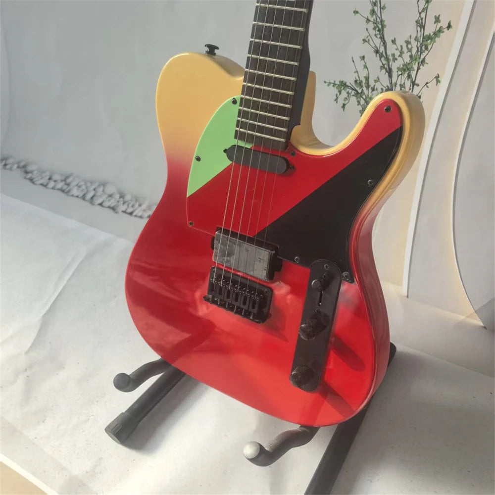 High-quality six-string electric guitar, with a two-tone body, rosewood fretboard, black hardware